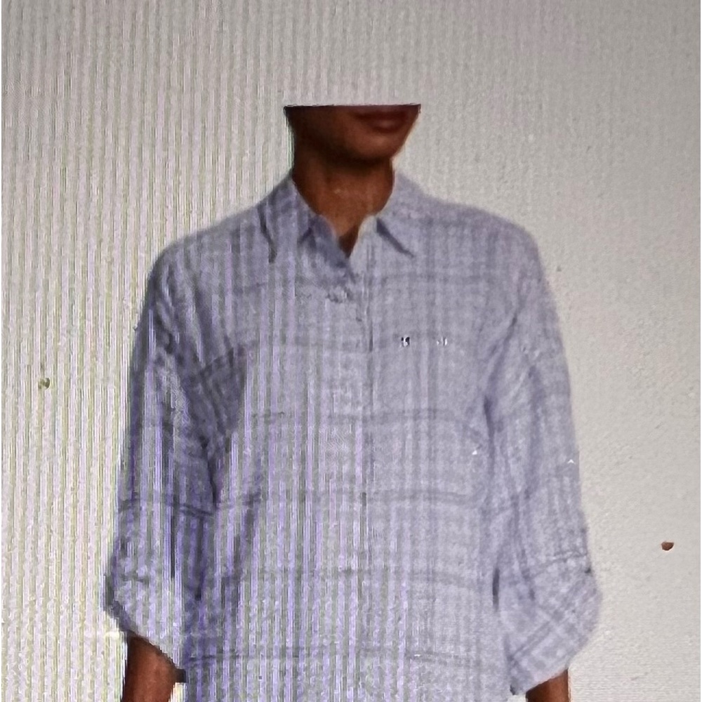 Boyfriend fit oversized button up blouse with roll cuff sleeve. 100% rayon.
